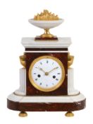 A French ormolu mounted red and white marble mantel clock, unsigned  A French ormolu mounted red and