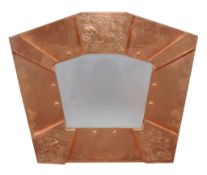 An Arts and Crafts copper wall mirror, 1920s, 76cm high, 89cm wide  An Arts and Crafts copper wall