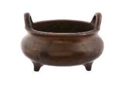 A large Chinese bronze censer, Qing Dynasty, of circular form A large Chinese bronze censer, Qing