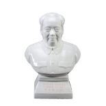 A white porcelain bust of Chairman Mao, circa 1960, with slogans at its base A white porcelain