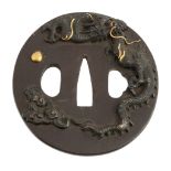 An Iron Tsuba , the polished plate applied in shakudo and gilding with a... An Iron Tsuba , the