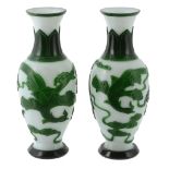 A pair of Peking glass emerald-green overlay vases A pair of Peking glass emerald-green overlay