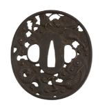 An Iron Choshu School Tsuba of oval form well carved in hikone-bori in the... An Iron Choshu