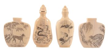 A Pair of Ivory Snuff Bottles , each of flattened shield shape and engraved... A Pair of Ivory Snuff