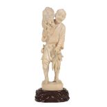 A Japanese Ivory Okimono of a Daikon Seller A Japanese Ivory Okimono of a Daikon Seller, the