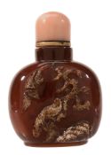 An Agate Snuff Bottle of a dark honey tone An Agate Snuff Bottle of a dark honey tone, carved in