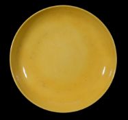 A large Chinese Imperial yellow-glazed Dish, Qing Dynasty, 18th/19th century A large Chinese