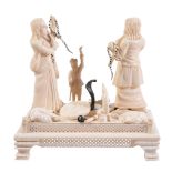 A Indian ivory group of snake charmers, early 20th century A Indian ivory group of snake charmers,