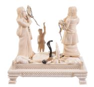 A Indian ivory group of snake charmers, early 20th century A Indian ivory group of snake charmers,