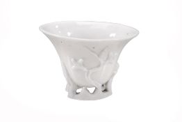 A Dehua Libation cup, Qing Dynasty, of deep oval U-shape A Dehua Libation cup, Qing Dynasty, of deep