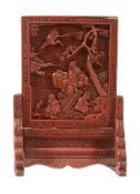 A small Chinese cinnabar lacquer screen, Qing Dynasty, 19th century A small Chinese cinnabar lacquer