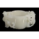 A Chinese white jade cup, 20th century, of lobed circular section A Chinese white jade cup, 20th