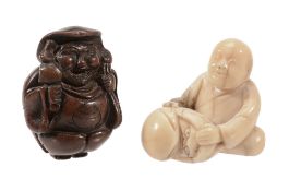 A Wood Netsuke of Daikoku, the portly figure stands with his sack over one... A Wood Netsuke of