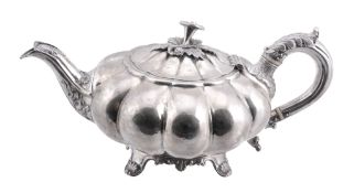A George IV Scottish silver melon pattern tea pot by J. McKay,   Edinburgh 1829, with a flower and
