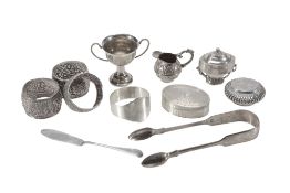A collection of small silver and silver coloured items,   comprising: an oval engine turned box by