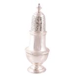 A silver baluster sugar caster by Goldsmiths  &  Silversmiths Co. Ltd.,   London 1913, with a bell