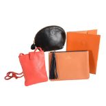 Loewe, a small red leather shoulder bag,   with a fold over push clip fastening the exterior with