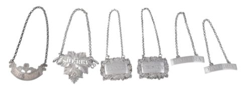 Five various Georgian and Victorian silver decanter labels,   one by Charles Reily  &  George