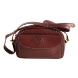 Must de Cartier, a small Bordeaux leather shoulder bag,   with a flap pocket embossed with the