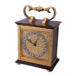 Hausmann  &  Co., a brass and lacquer table clock,   alarm movement, silvered Roman numeral chapter