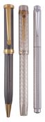 Three pens,   an Excel Onoto, the barrel and cap are guilloché engraved with a Hera weave pattern,