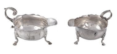 A William IV silver oval cream boat,   London 1836, and another similar, crested, marks rubbed and