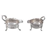 A William IV silver oval cream boat,   London 1836, and another similar, crested, marks rubbed and