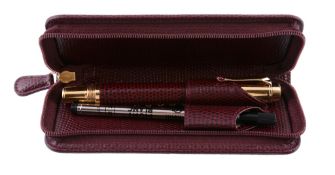 Montblanc, Boheme  ,   a burgundy rollerball pen,   the burgundy calf leather barrel, to a gilt