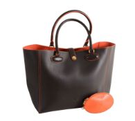 Loewe, a brown leather tote bag,    with orange stitching and a push button fastening, an orange