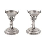 A pair of Austro-Hungarian silver figural salt cellars,   maker's mark WG (not traced), 1867-1872 .