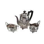 A silver swollen oblong three piece coffee service by C. S. Harris  &  Sons,   London 1925-26, the