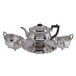 A silver oblong baluster three piece tea service by The Goldsmiths  &  Silversmiths Co. Ltd,