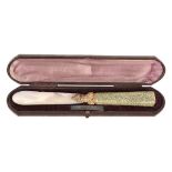 A 19th century gold mounted mother of pearl and shagreen paper knife,   with a mother of pearl