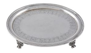 A Victorian silver oval tea pot stand,   maker's mark overstruck, London 1867, engraved with a