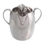 An Irish silver double lipped and double spoutted swollen cream jug by Wakely  &  Wheeler,   Dublin