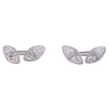 A pair of diamond cufflinks,   the marquise shaped pierced panel set with a central brilliant cut