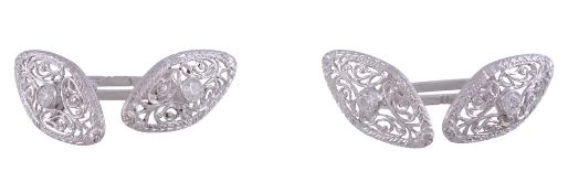 A pair of diamond cufflinks,   the marquise shaped pierced panel set with a central brilliant cut