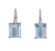 A pair of aquamarine and diamond earrings,   the rectangular shaped aquamarine in a four claw