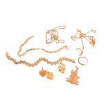 A collection of  gold coloured jewellery,   to include: a heart shaped pendant with a partial