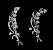 Two diamond set lily of the valley brooches,   each designed as a lily of the valley spray set with