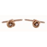 A pair of Swedish 18 carat gold seed pearl cufflinks,   the knot terminals each centred with a half