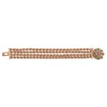 A 14 carat gold, jadeite, ruby and diamond bracelet,   composed of four ropetwist strands, to a