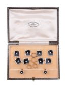 A diamond and onyx dress set,   circa 1930, the cufflinks with onyx panels each centred with a