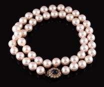 A cultured pearl necklace,   the fifty uniform cultured pearls to an 18 carat gold diamond and