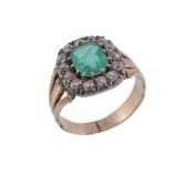 A Victorian emerald and diamond cluster ring,   the step cut emerald with canted corners within a
