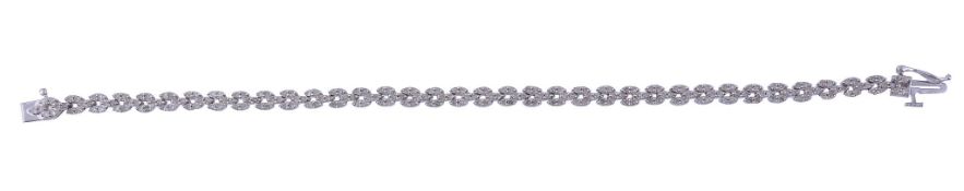 A diamond line bracelet,   the pierced articulated panels set with eight cut diamonds,