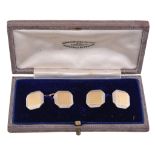 A pair of gold and platinum cufflinks  , circa 1930, the octagonal panels with a central square of