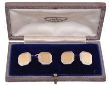 A pair of gold and platinum cufflinks  , circa 1930, the octagonal panels with a central square of