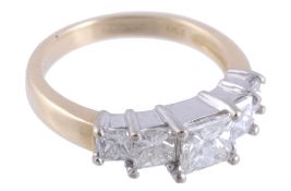 A diamond five stone ring,   set with five graduated princess cut diamonds, stamped 750 with London