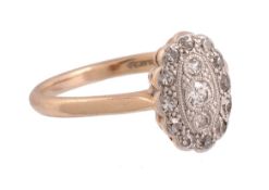 A diamond ring,   the oval shaped panel set with a central brilliant cut diamond within a surround